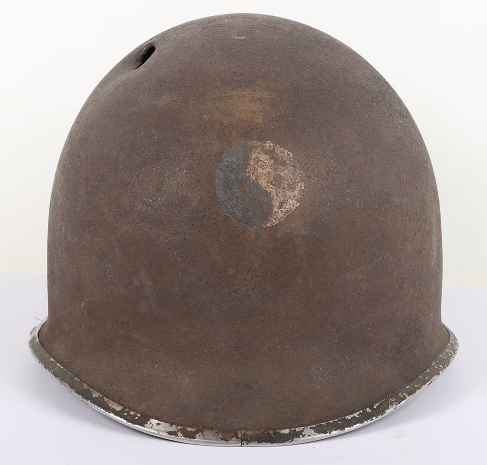 #445 – WW2 American Battle Damaged M1 Steel Combat Helmet with Insignia of the 29th Infantry Division, Who Were Instrumental in the D-Day Landings, Landing at Omaha Beach on 6th June 1944