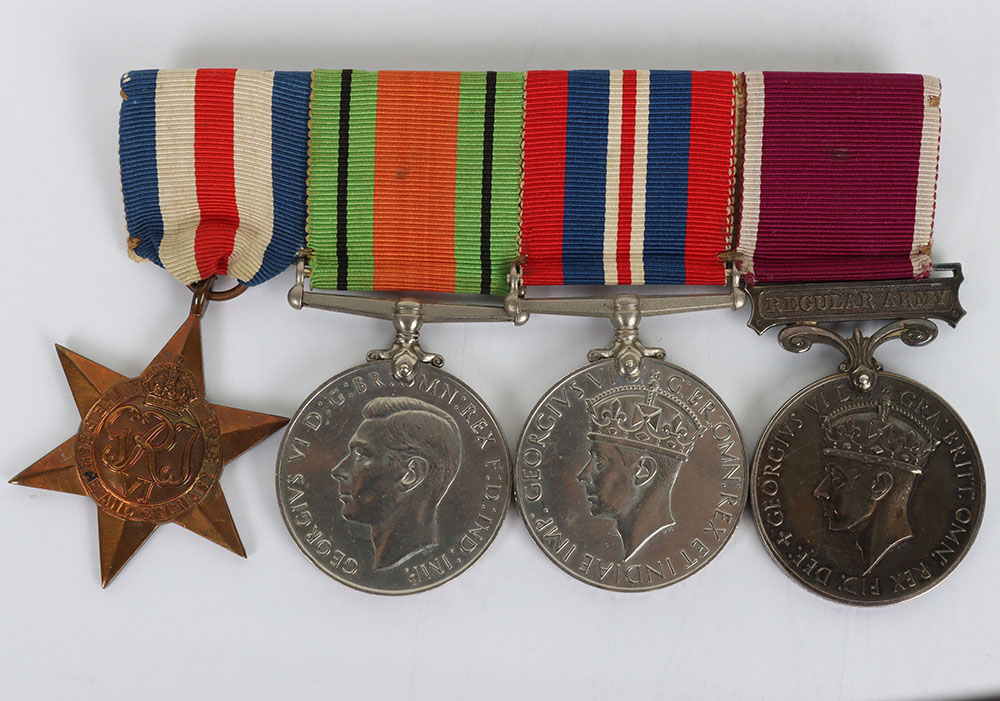 #58 – A Second World War Long Service Medal Group of Four to a Corporal of Horse in the Royal Horse Guards