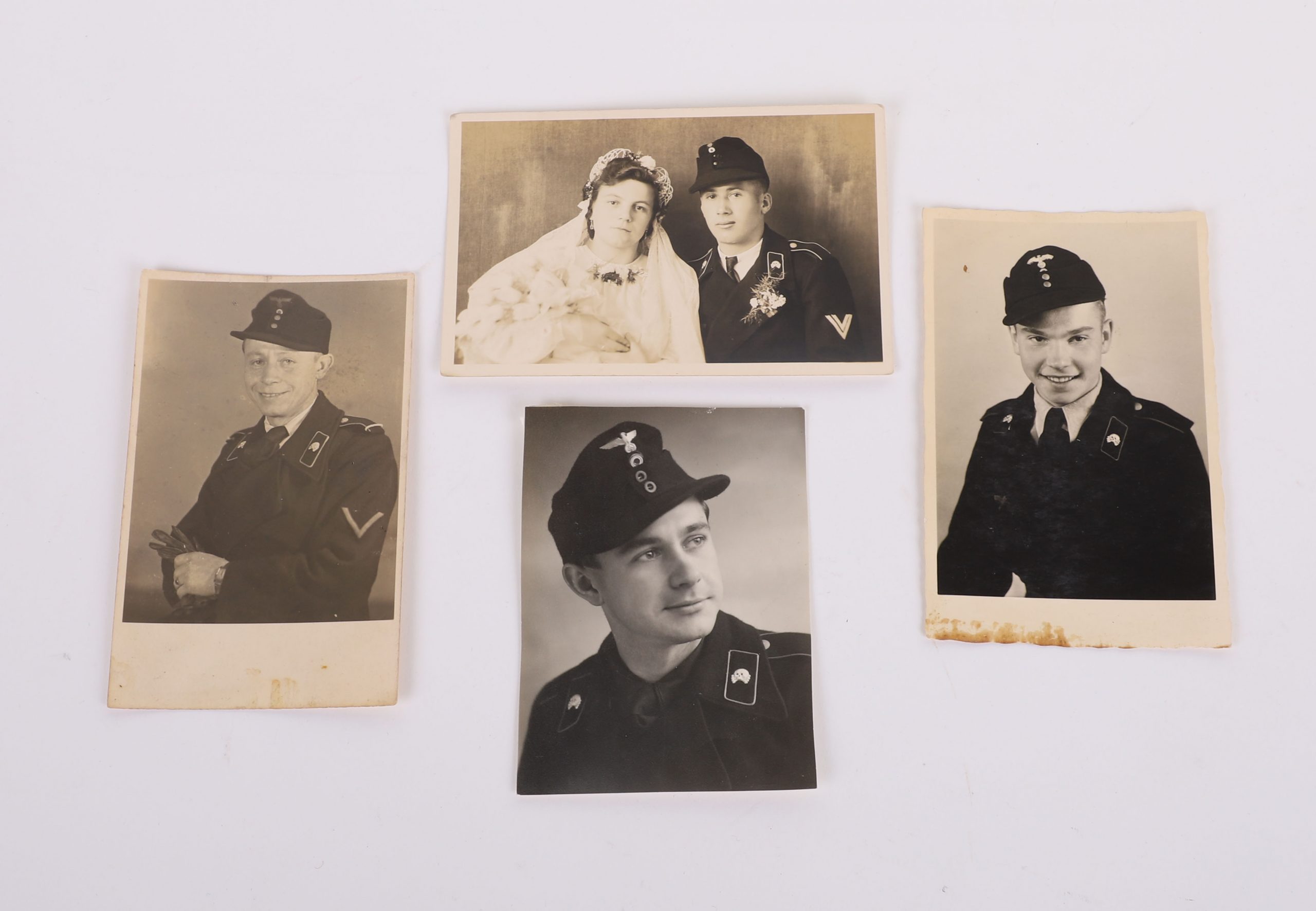 #124 – 4 HEER PHOTO POSTCARDS & ALL ARE WEARING A BLACK PANZER WRAPPER