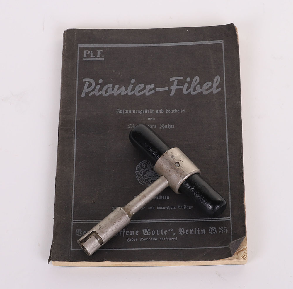 #180 – WW2 GERMAN WEHRMACHT PIONEERS HAND BOOK & A DETONATOR HANDLE