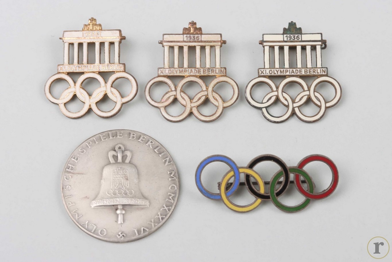 #75-1878 – 1936 Olympic Games in Berlin – four enameled badges and one silver medal