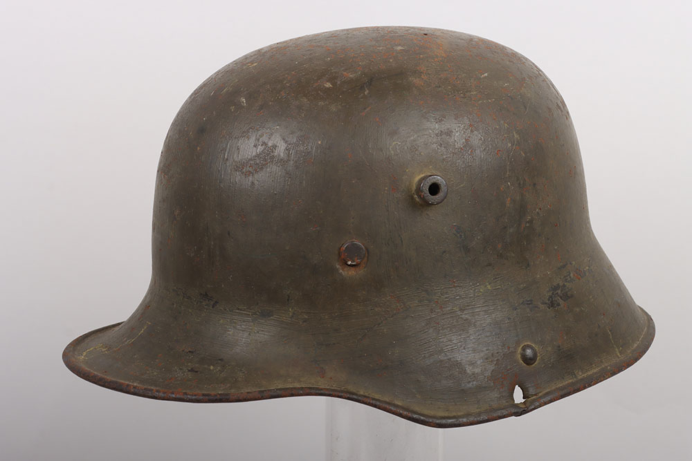 #610 – WW1 German M-16 Battle Damaged Steel Combat Helmet